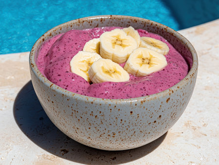 Delicious berry smoothie bowl with banana slices, healthy breakfast, summer vibesの素材