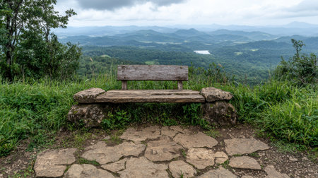 Wooden bench overlooking a mountain vistaの素材