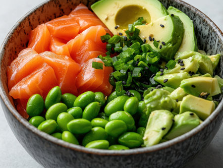 Delicious and healthy poke bowl with salmon, avocado, edamame, and sesame seedsの素材