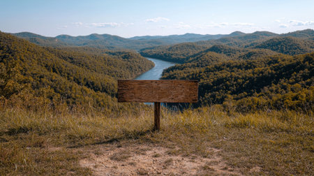 Blank wooden sign overlooking a scenic river valleyの素材