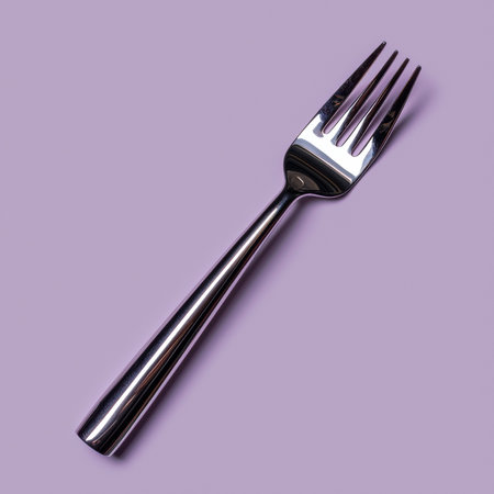 Silver fork on purple backgroundの素材
