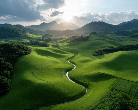 Serene landscape of rolling green hills and a winding riverの素材
