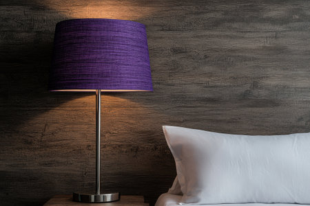 Purple lamp on nightstand next to bedの素材