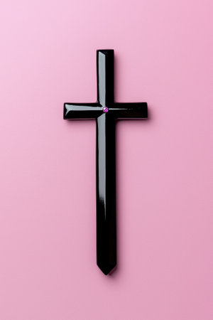 Black cross with pink gem on pink backgroundの素材