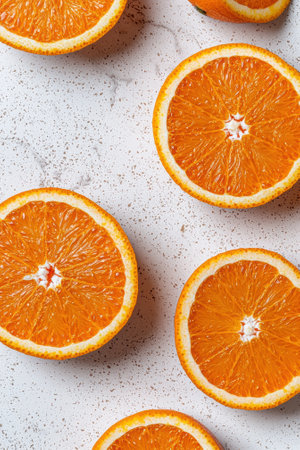 Bright orange slices on a marble backgroundの素材