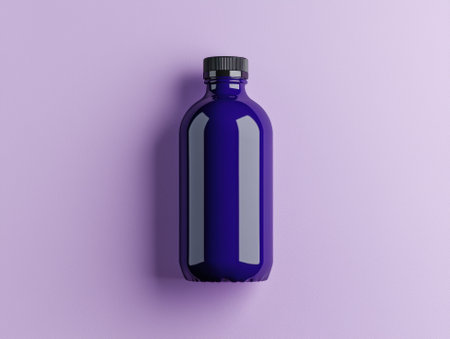 Dark purple glass bottle with black cap on purple backgroundの素材