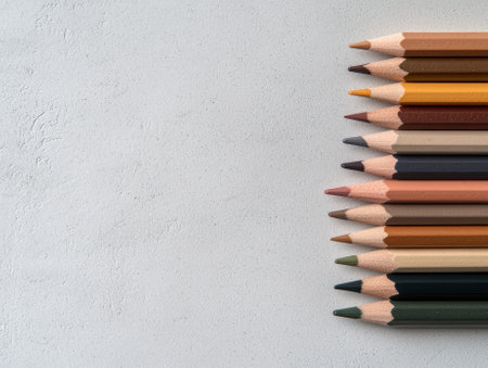 Colored pencils lined up on a white backgroundの素材