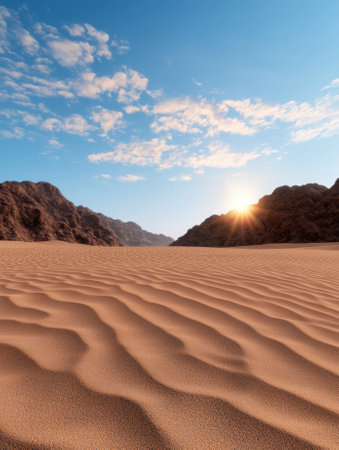 Sunset over desert dunes and mountainsの素材