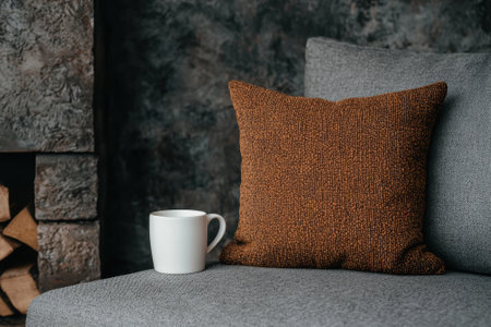 Cozy living room with a cup of coffee and throw pillowsの素材