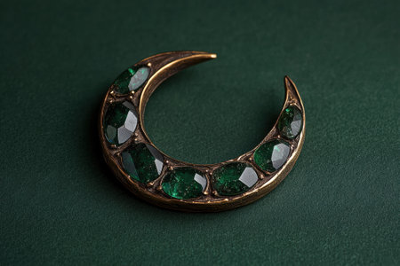Crescent moon jewelry with green gemstonesの素材
