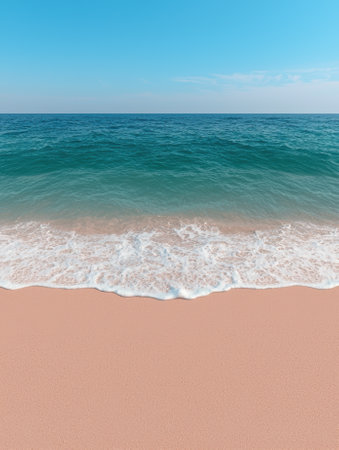 Waves gently washing onto a pink sand beach on a sunny day.の素材