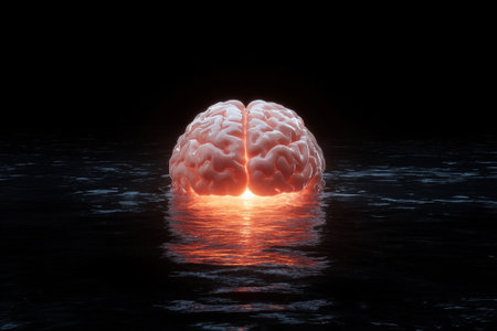 A brain submerged in water with a bright glow emanating from within.の素材
