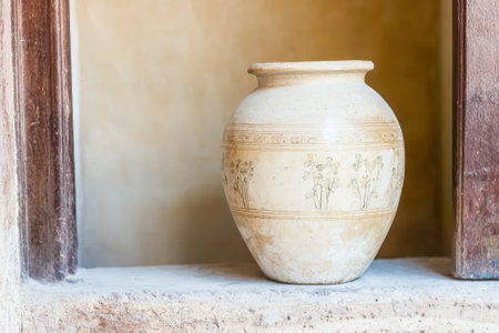 Antique vase with floral design in a niche.の素材