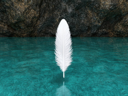 White feather floating on water in a serene landscape.の素材