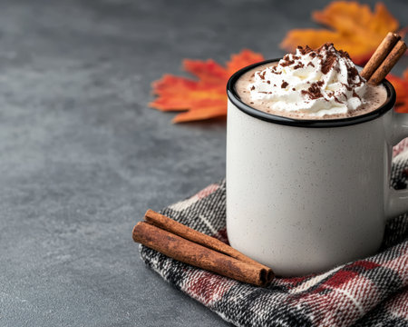 Hot chocolate with whipped cream and cinnamon sticks.の素材
