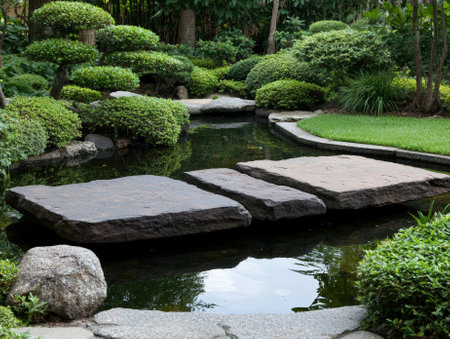 Serene Japanese garden pond with stone path.の素材
