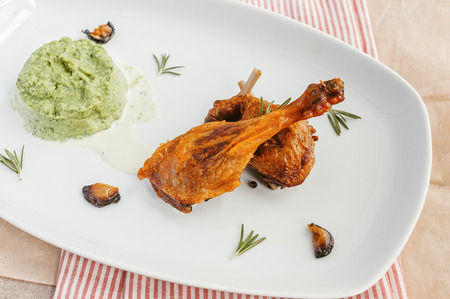 roasted chicken leg with green pastyの写真素材