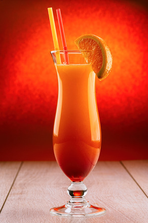 Red cocktail with orange sliceの写真素材