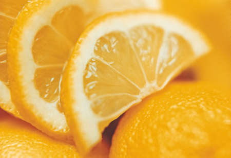 Juicy orange slices with whole fruit close-up, organic oranges agricultural crop from fruit farm, selective focus, positive film scanの写真素材