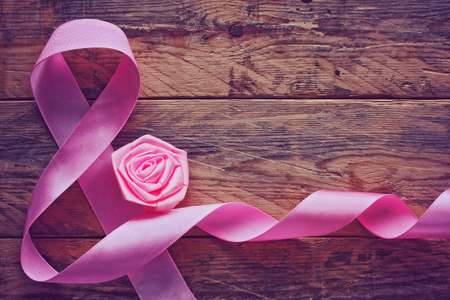 background with a pink silk ribbon, International Women's Dayの写真素材