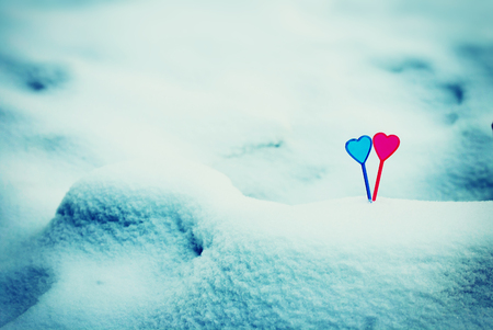 Valentine's day background with couple of heart in snowの写真素材