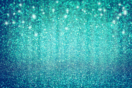 Blue Christmas glitter background with stars, textured surface, selective focusの写真素材