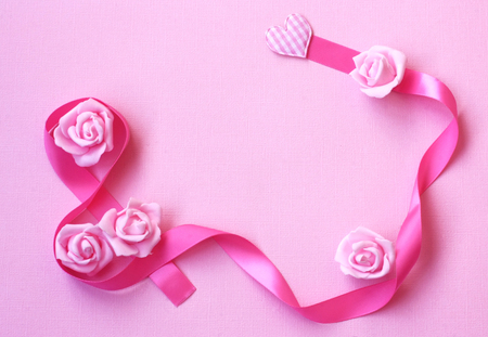 gentle background with pink silk ribbon, rose flowers, International Women's Day, 8 march card の写真素材