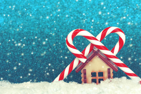 Christmas, New year background, toy house and two striped lollipops, retro style, selective focusの写真素材