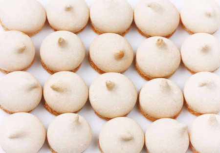 small meringue cookies, arranged in row, homemade cakes, closeup, top viewの写真素材