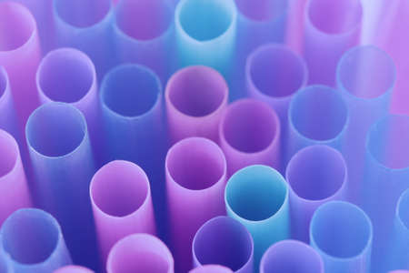 Very peri violet pink toned abstract background with cocktail tubes, trend color, closeup, macroの写真素材