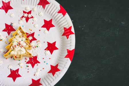 Christmas decoration, marshmallows in shape of Christmas tree with confectionery sprinkles on paper...