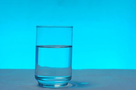 glass isolated in blue backgroundの写真素材