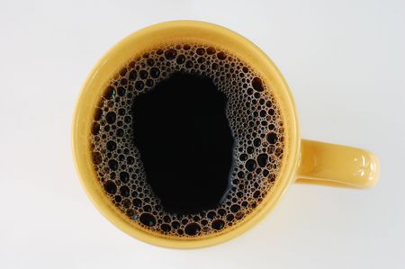 coffee in yellow mugの写真素材