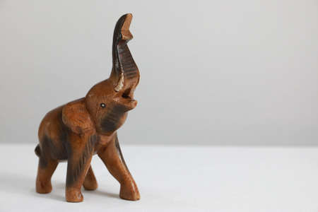 Wooden statue in the shape of an elephant with a white background, for home decorationの写真素材