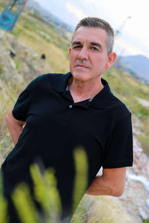 Handsome and healthy man who takes care of himself is 60 years old, in a field in Alicanteの写真素材