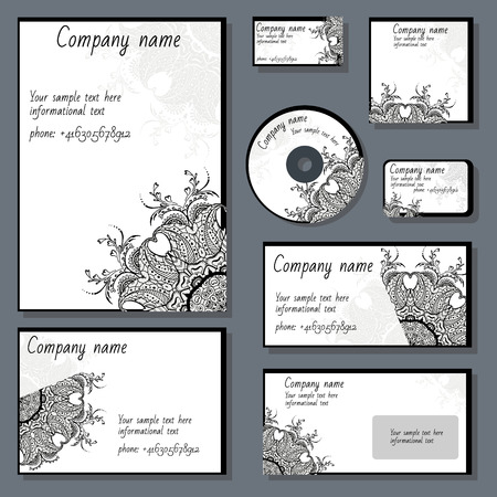 Set of templates for cd disks, envelopes, notebooks, credit card, business card and invitation card with floral ornament. Corporate style vector.のイラスト素材