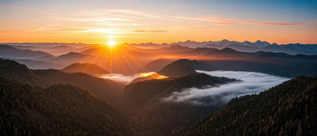 Foggy sunrise over the mountains. Panoramic view.の素材