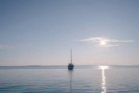 Sailing yacht in the sea at sunset. Beautiful summer landscape.の素材