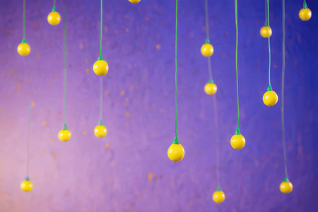 Christmas decorations hanging on a blue background. New Year and Christmas concept.の素材