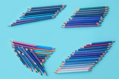 Set of colored pencils on a blue background. Flat lay.の素材