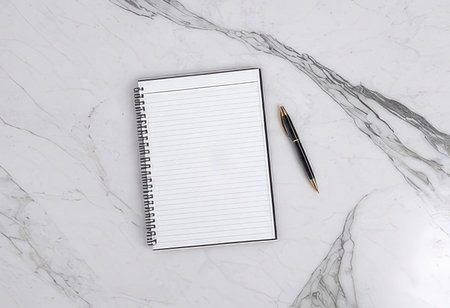 Notebook and penle background, top view, copy spaceの素材