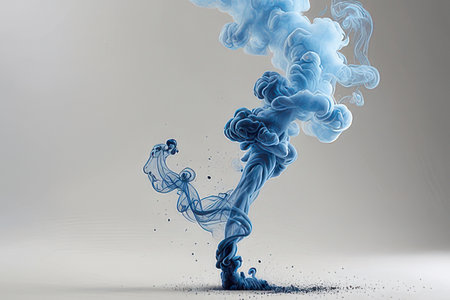 Blue ink in water on white background. Abstract background.の素材