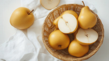 Fresh pears in a basket on a white background. Top view.の素材