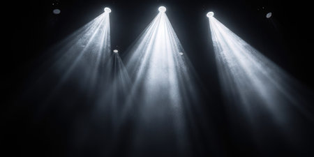 Stage lights on a black background. Spotlight in the dark. Stage lighting effect.の素材