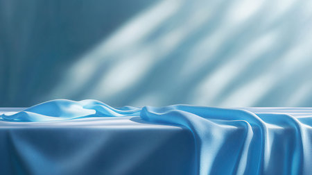 blue satin fabric on blue background with copy space for text or imageの素材