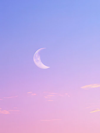 Crescent moon in the sky at sunsetの素材