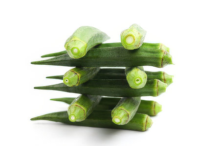 Fresh okra on white background. Vegetable in the form of a pyramidの素材