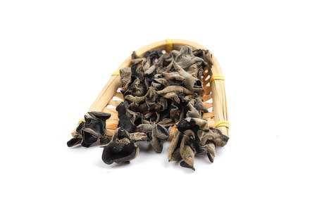 dried black fungus isolated on white background.Dried mushrooms.の素材
