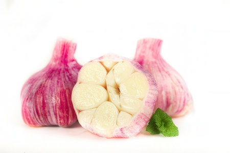 Garlic isolated on white background. Clipping path included for easy editing.の素材
