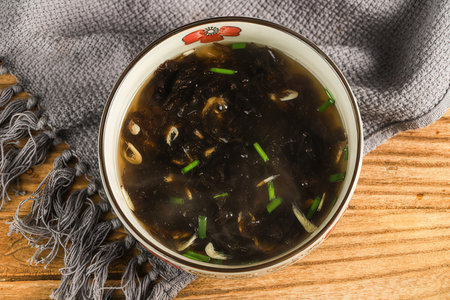 Mushroom soup in bowl on wooden background. Top view.の素材